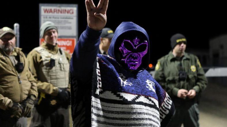 An Area 51 Raid attendee holds up the Vulcan peace sign in support of the theory that aliens are being hidden inside Area 51.