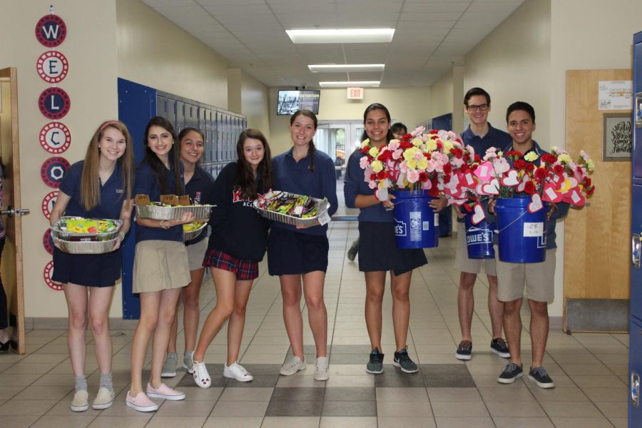 Key Club passes out the Candy and Carnations at the beginning of first period. (Photo Credit: Mrs Susan Lockmiller)
