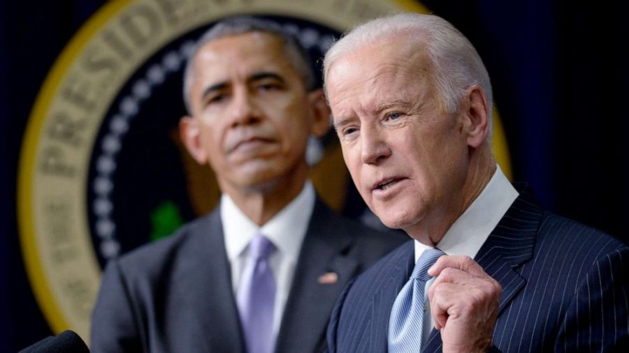 Vice President Joe Biden speaks as President Barack Obama looks during a bill signing in Washington, D.C., Dec. 13, 2016. Photo Credit: Courtesy of the Associated Press