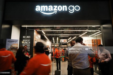 This image features people shopping in the new Amazon food store in New York City. It opened on May 7, 2019. The image demonstrates the amount of people interested in this new grocery store. (Photo Credit: Spencer Platt)