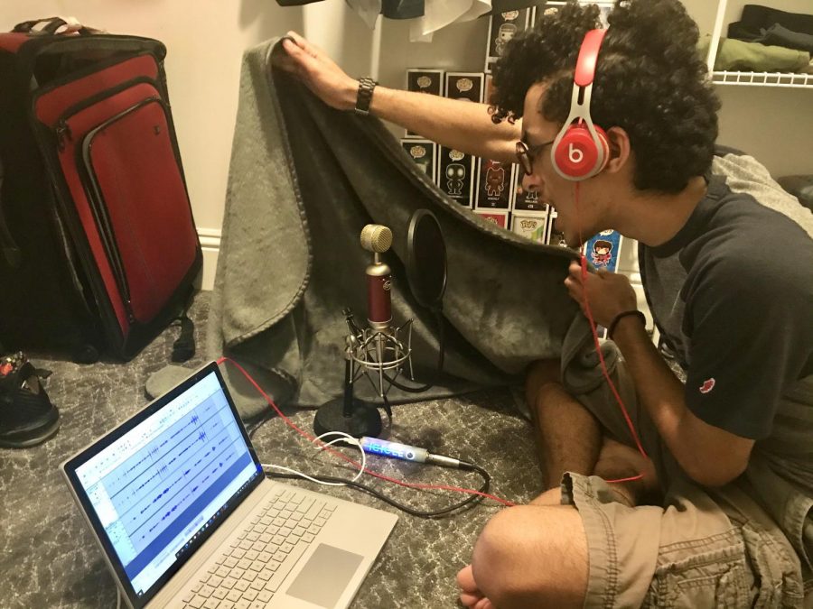 Logan Weisberg records lines for The Belling Program in a makeshift recording studio in his closet. (Photo Credit: Ava Rose Weisberg)
