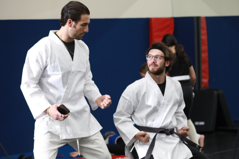 Giuseppe is standing in a fighting stance while learning martial arts.